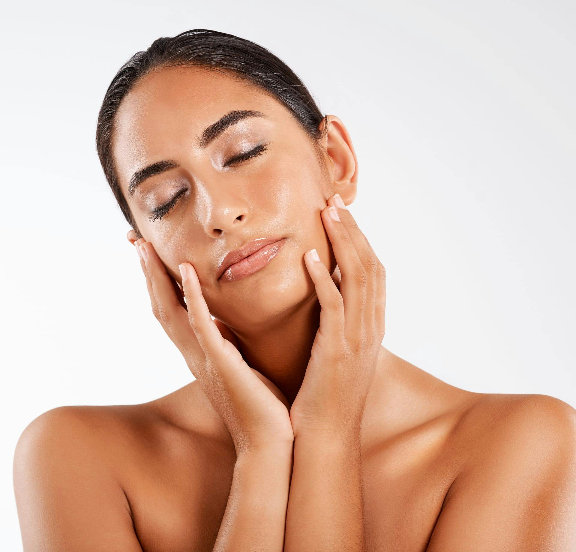 Woman holding her cheeks