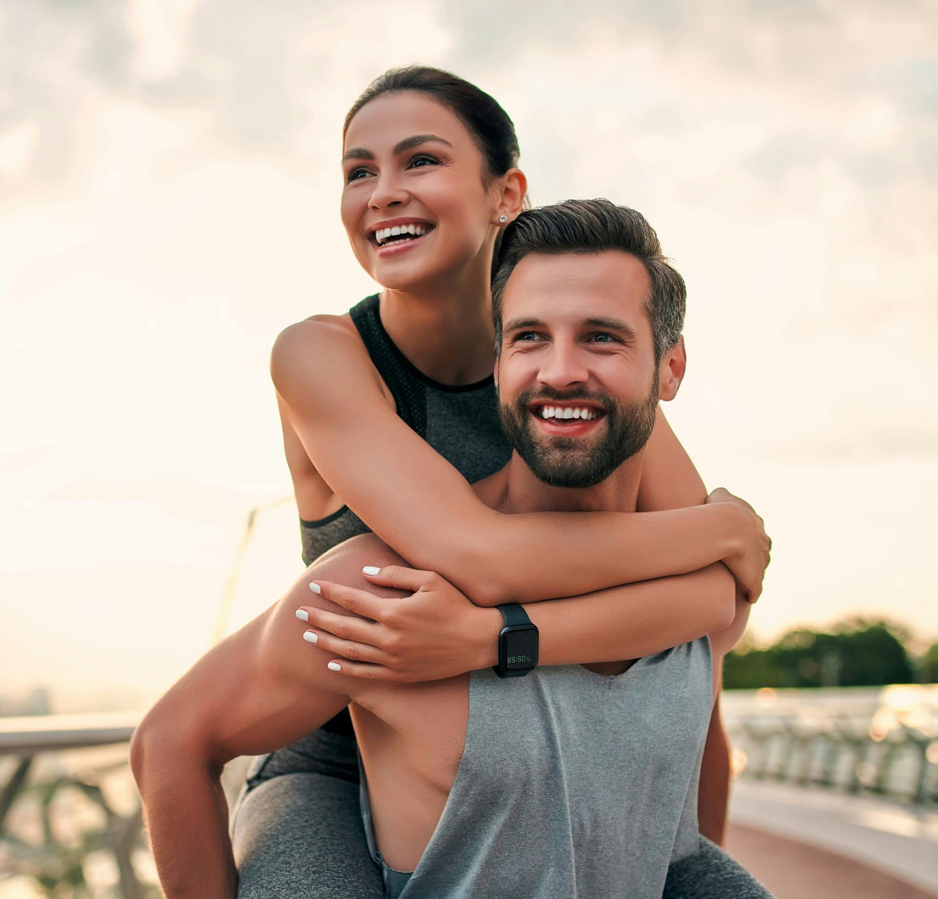 Man carrying woman piggyback