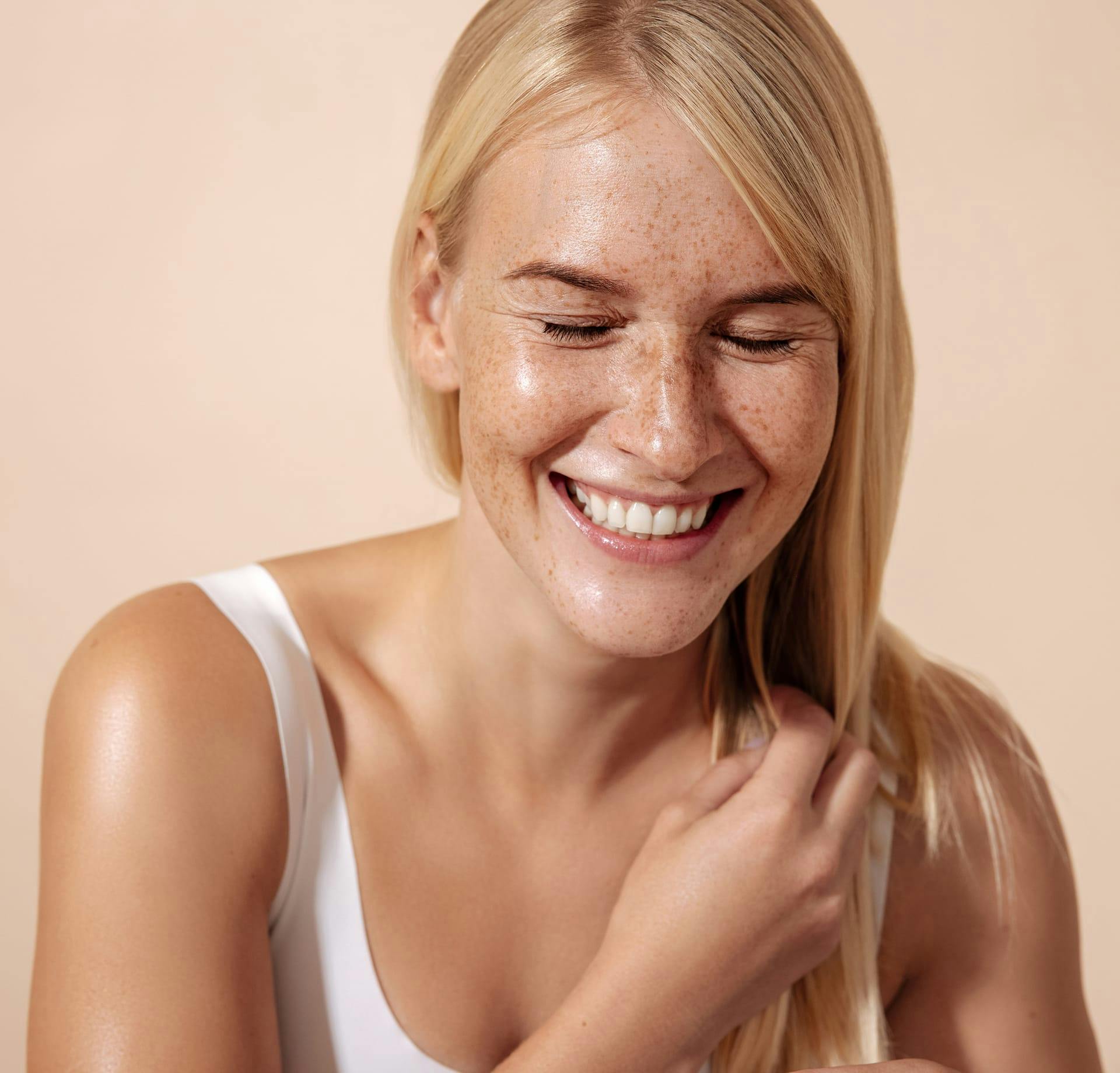 Freckled woman laughing