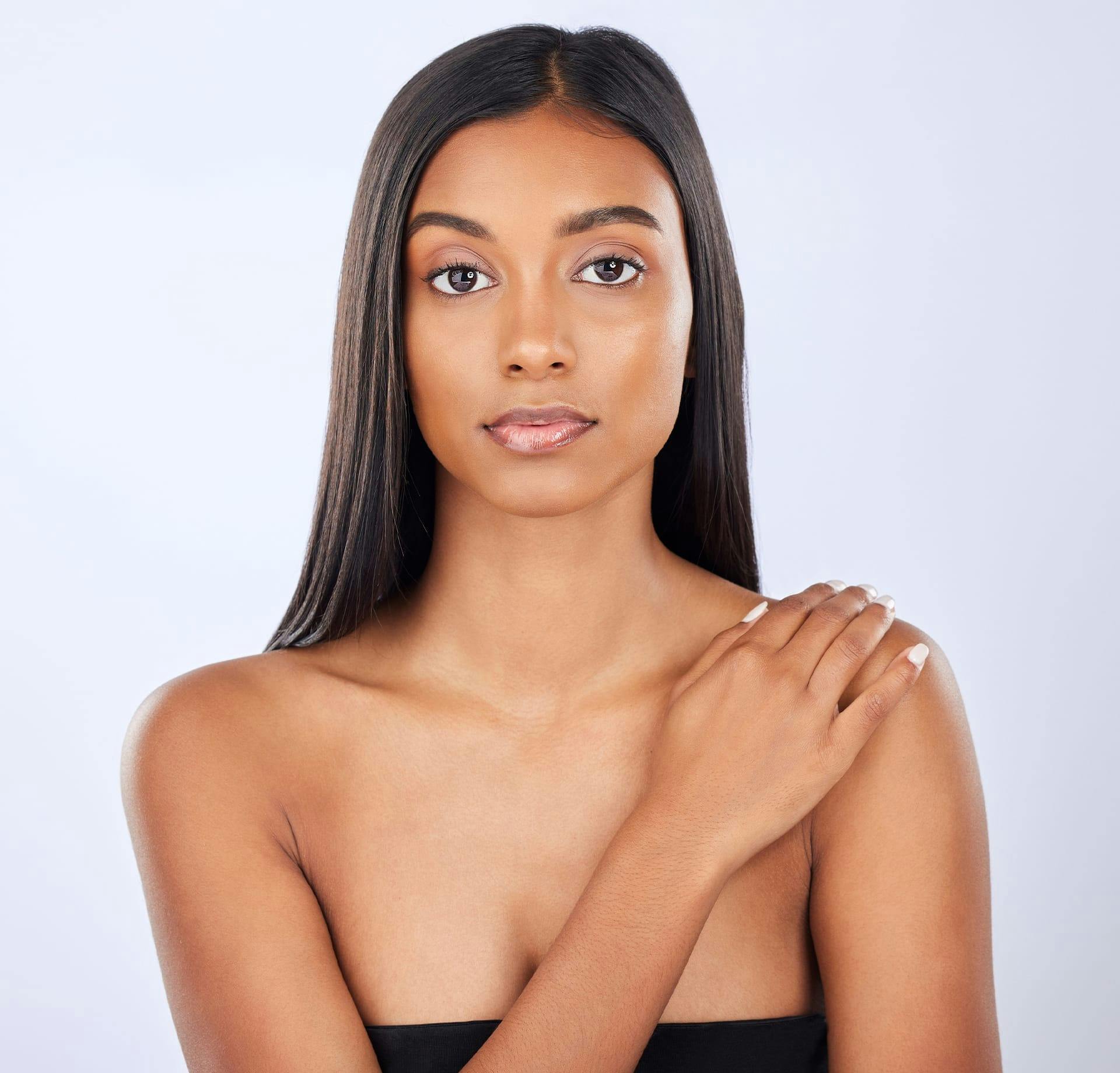 woman crossing hand over shoulder