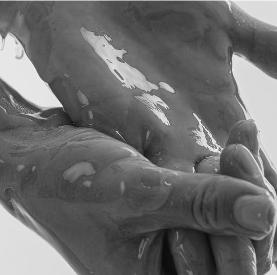 Two hands with water on them