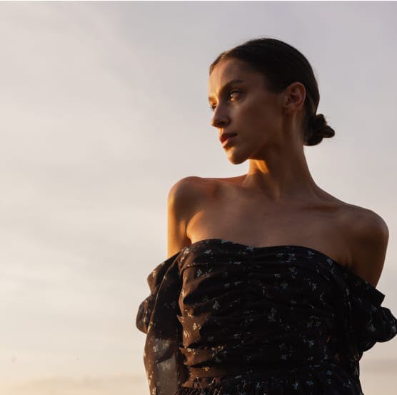 Girl in a dress at sunset