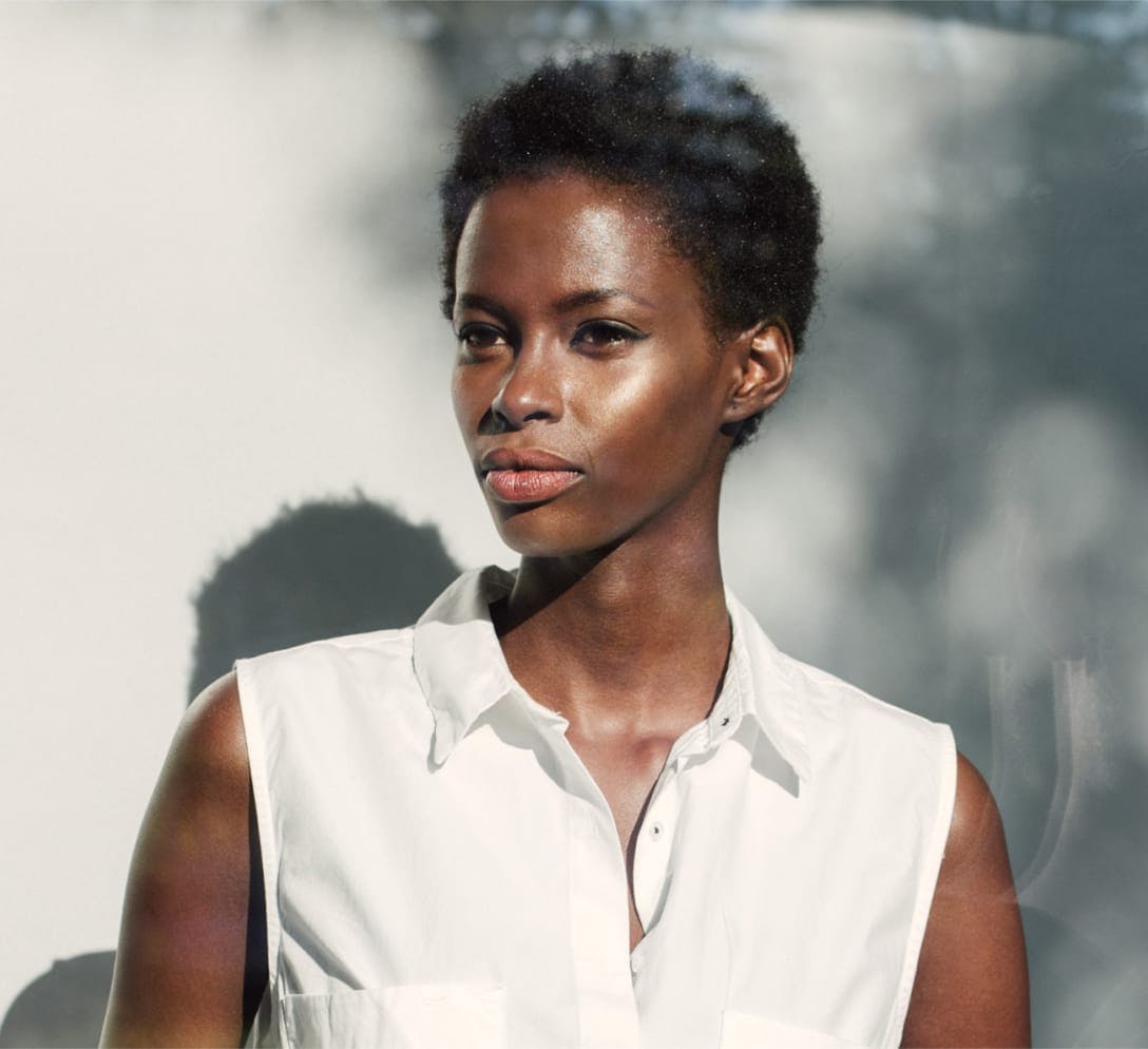Black woman with short, curly hair