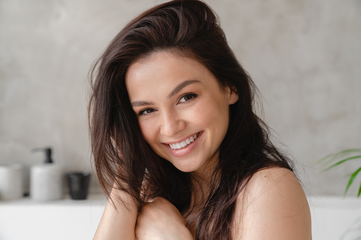 A woman with brown hair smiling
