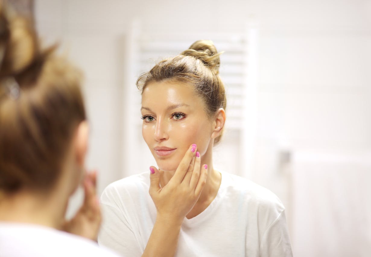 woman looking in the mirror