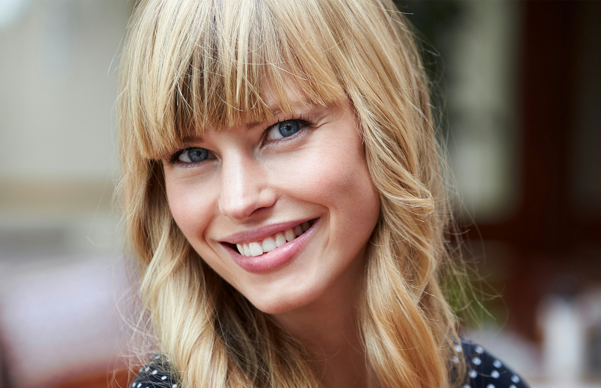 blond woman smiling at the camera