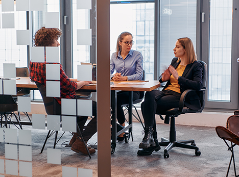 Group of employees holding a meeting