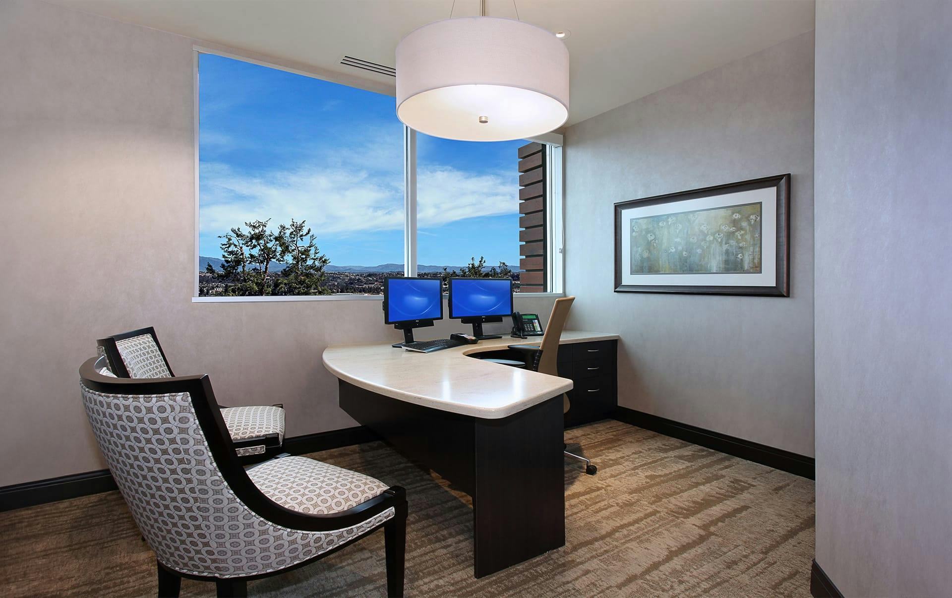 desk with chairs across from it
