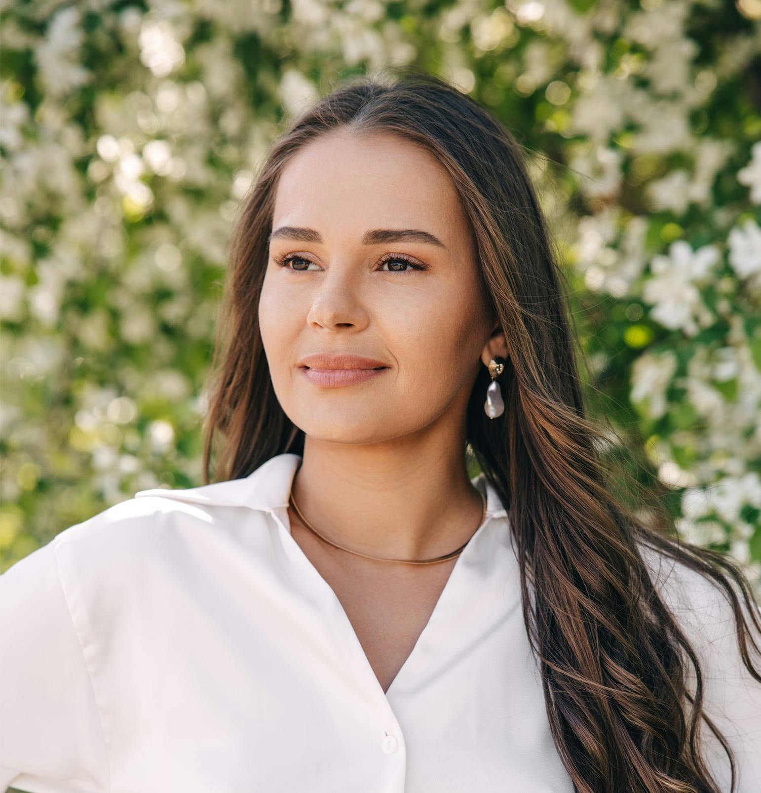 woman in white shirt and long brown hair