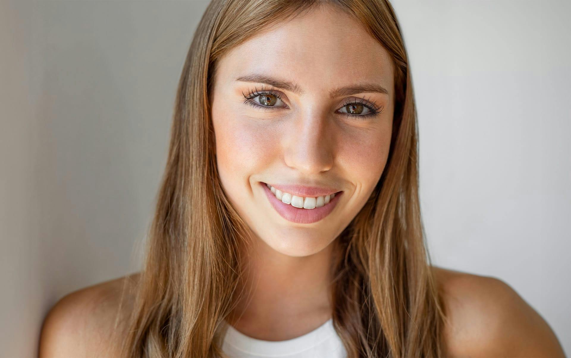 woman with brown hair smiling