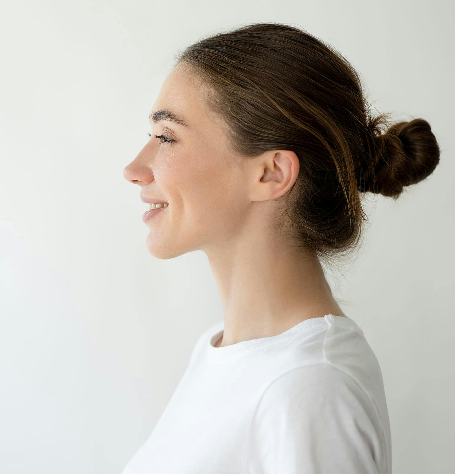 side angle of woman in bun