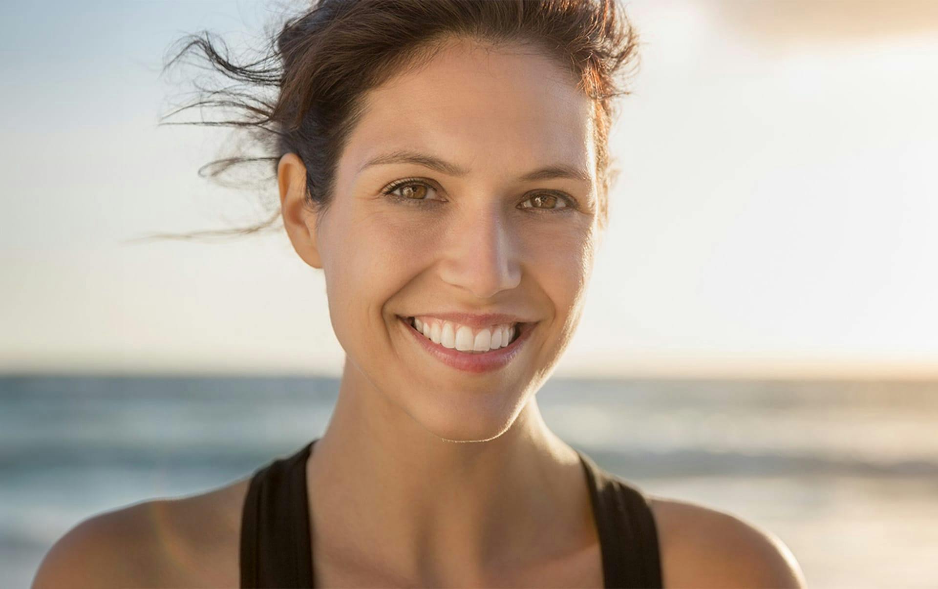 woman smiling on the beach
