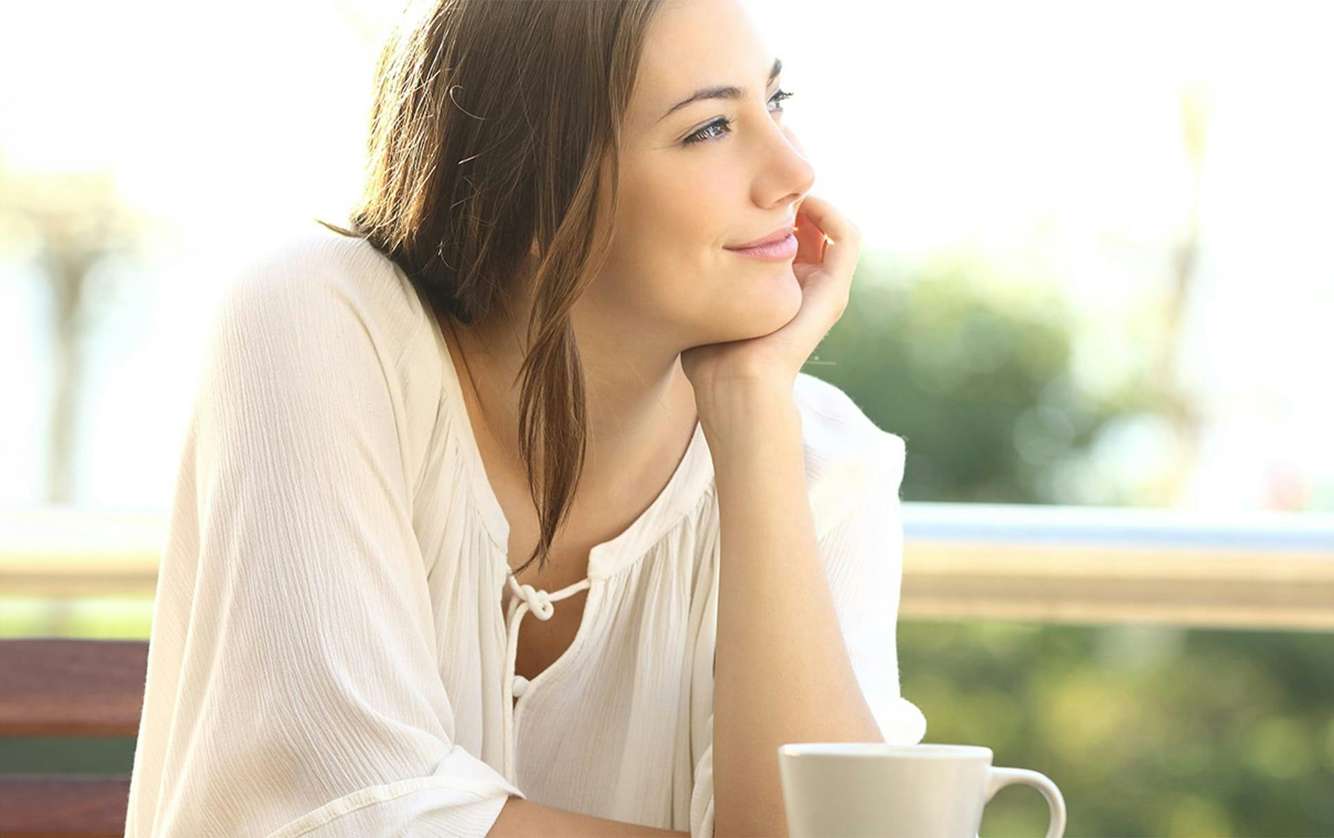 woman looking to the right with mug