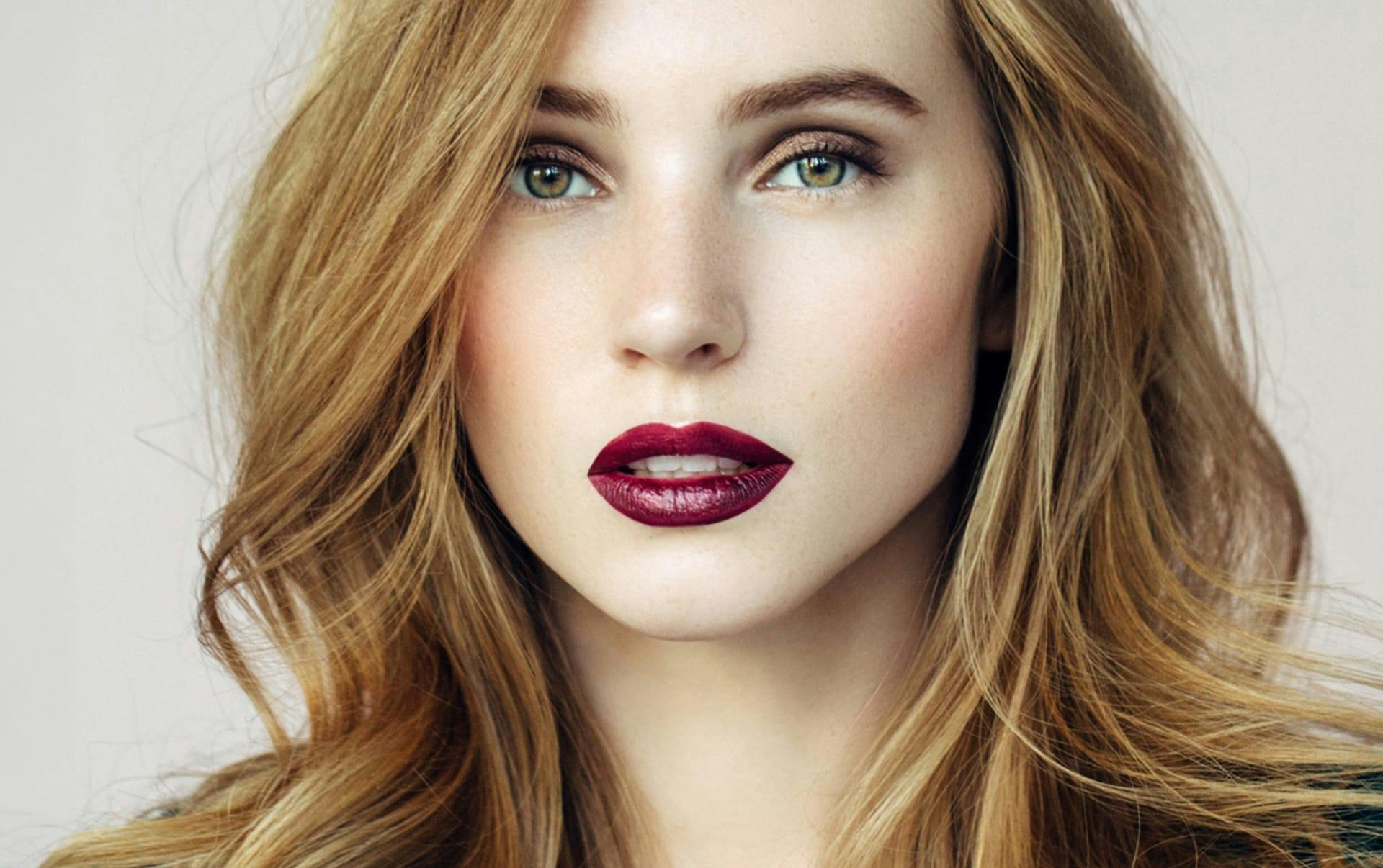 woman with red hair and red lipstick
