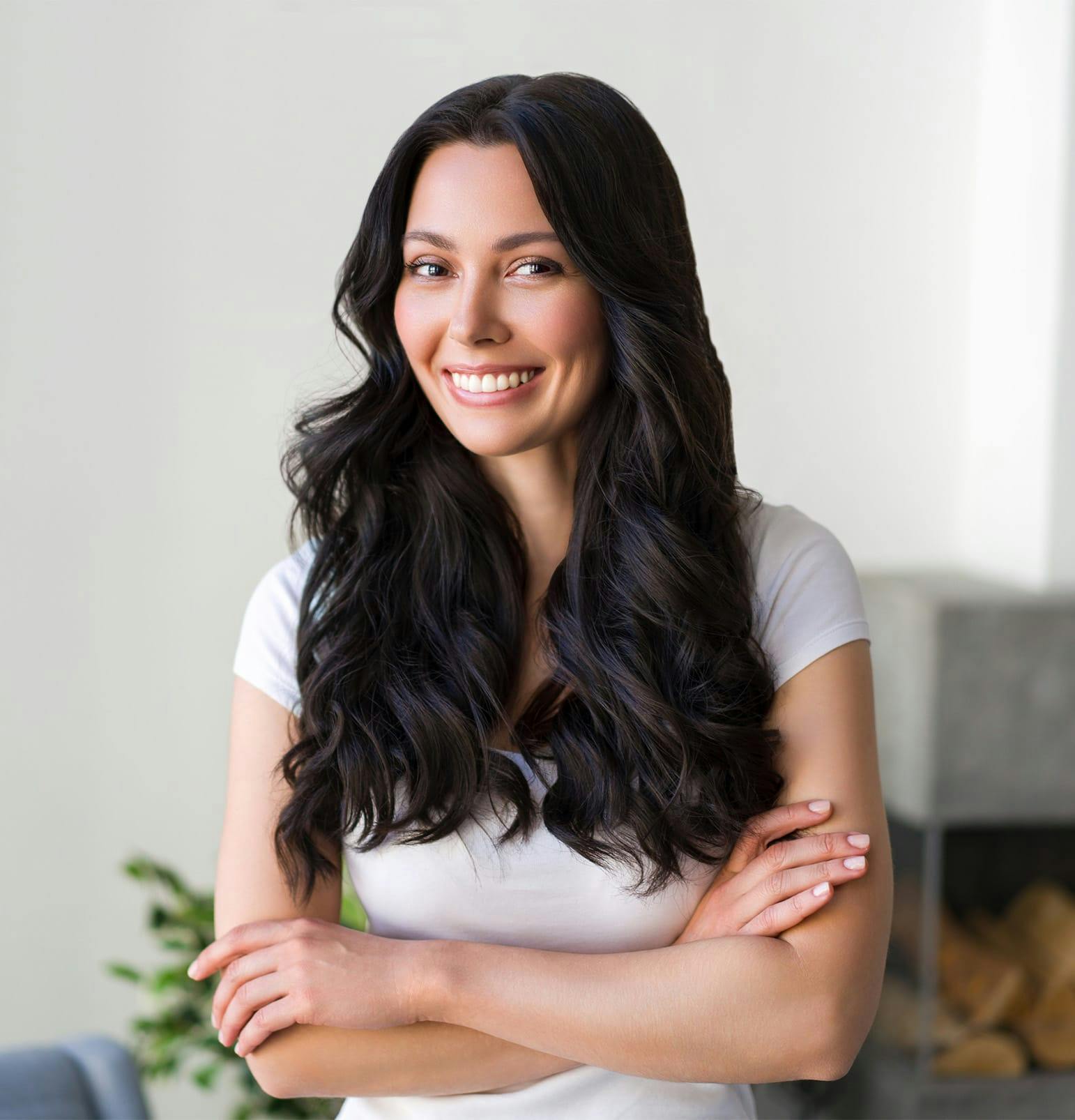woman with long black hair and arms crossed
