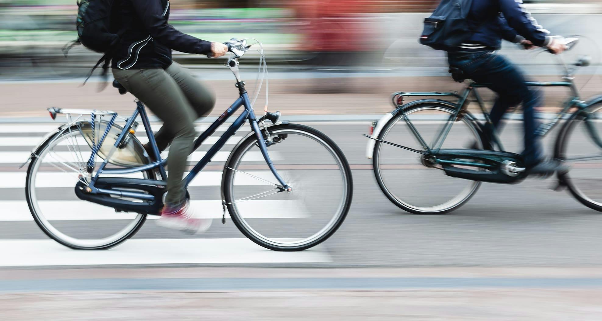 2 bicyclists biking