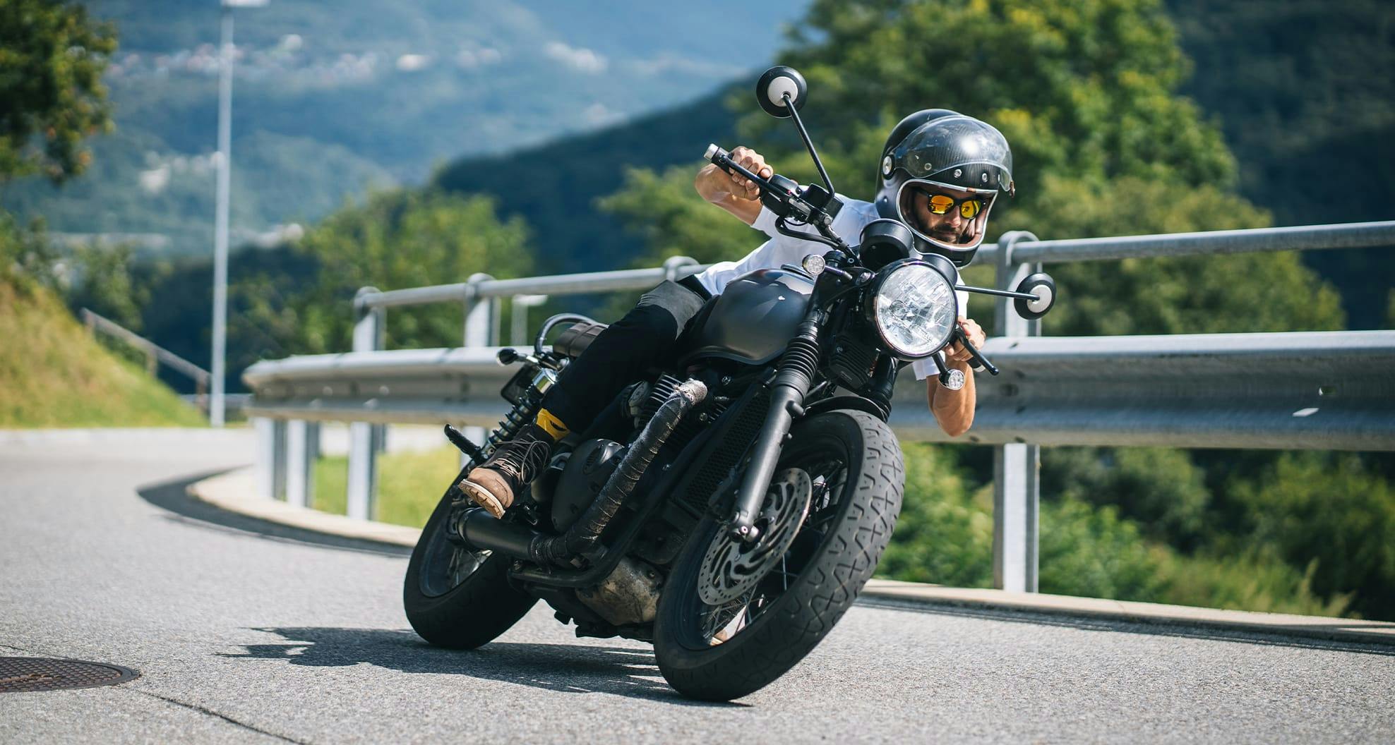 motorcycle leaning on side of road