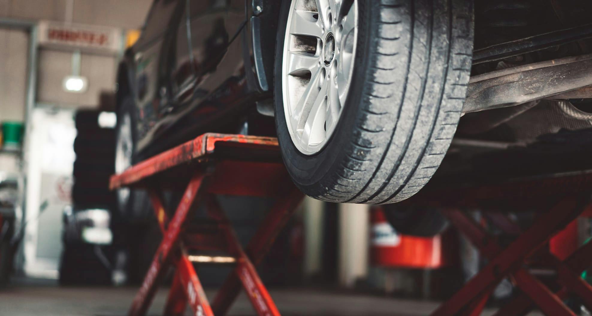 view of car tire lifted up