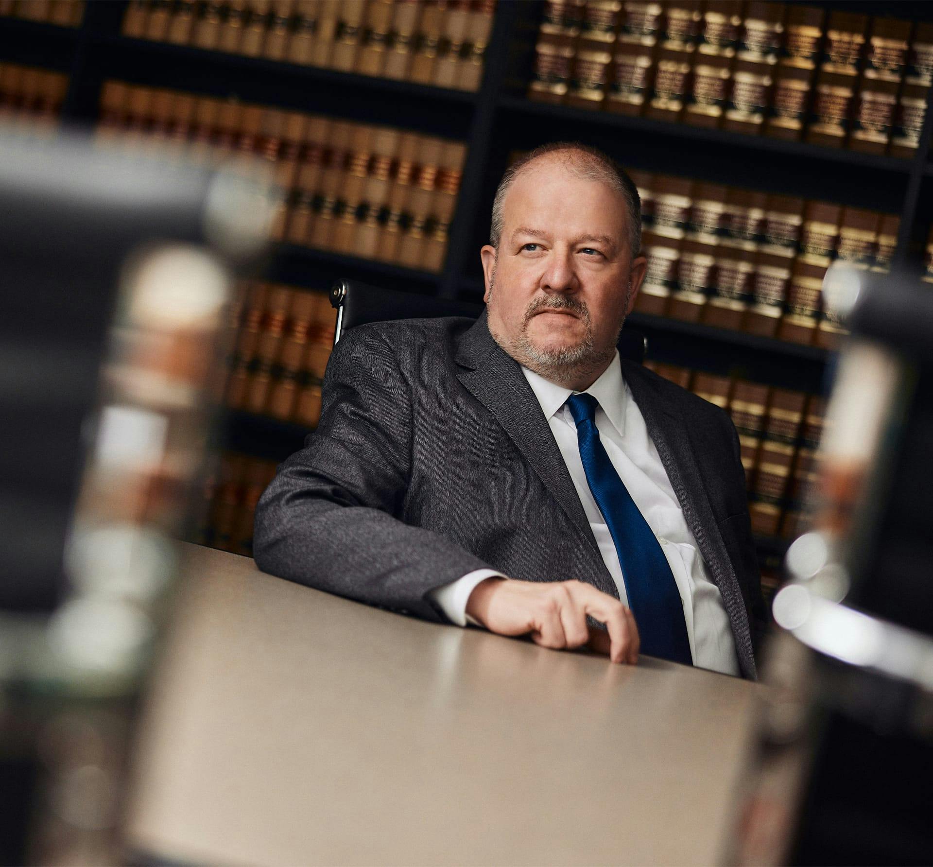 man in suit sitting in office
