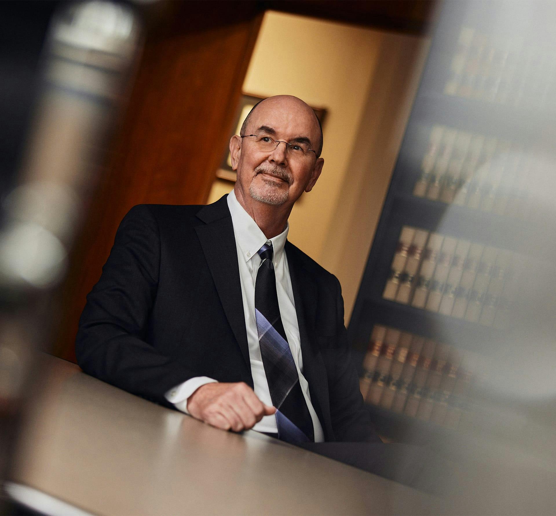man in suit sitting down