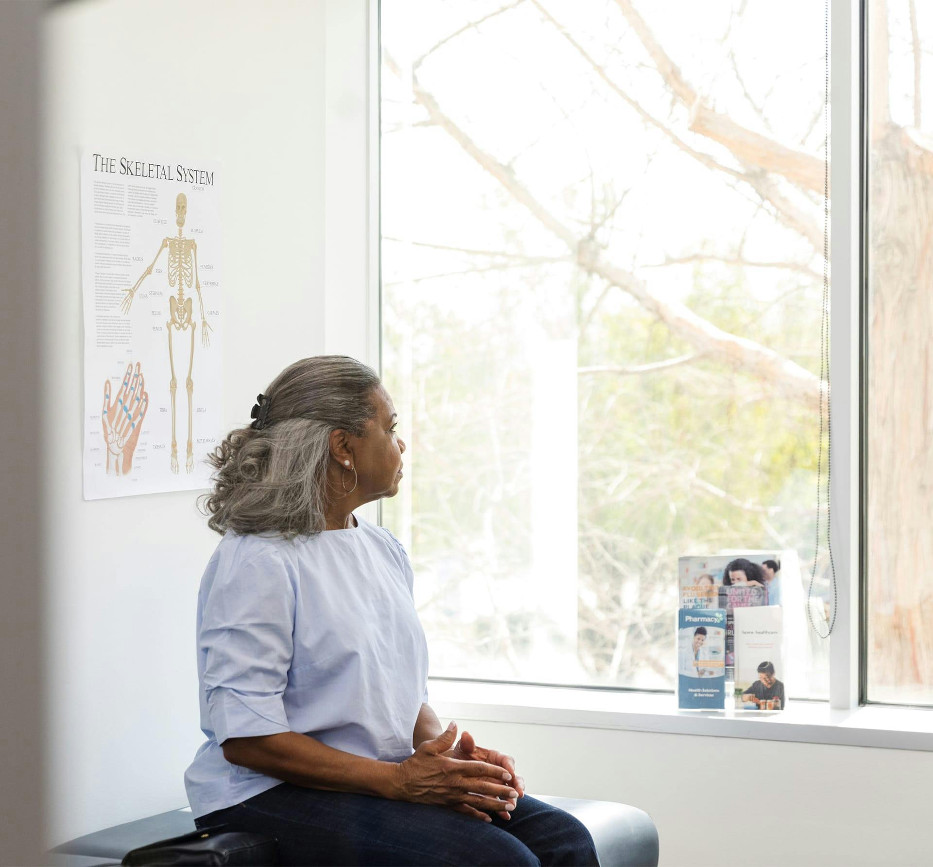 woman looking outside hospital window