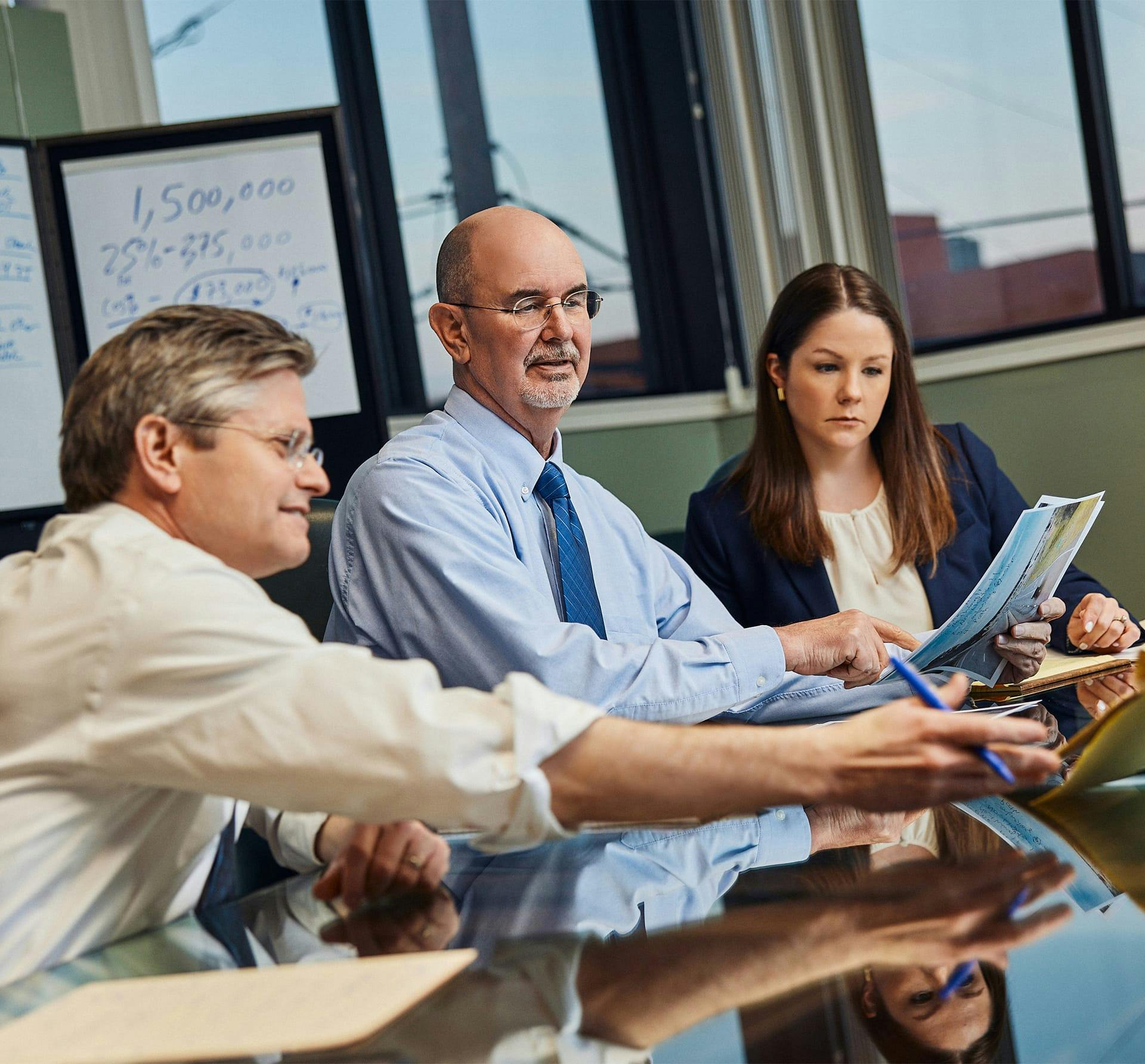 3 people working at table