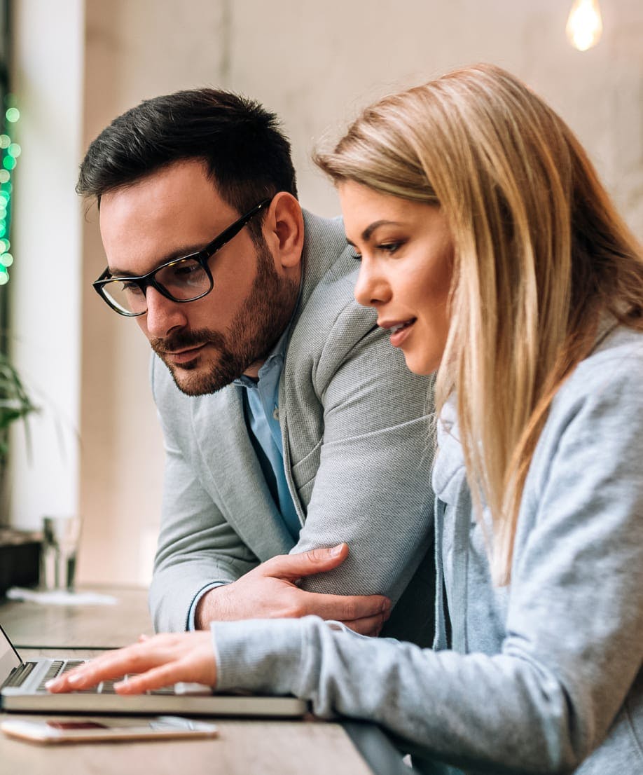 man and woman on a laptop