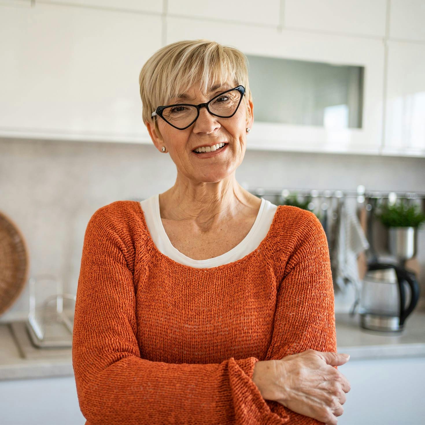 smiling woman crossing her arms