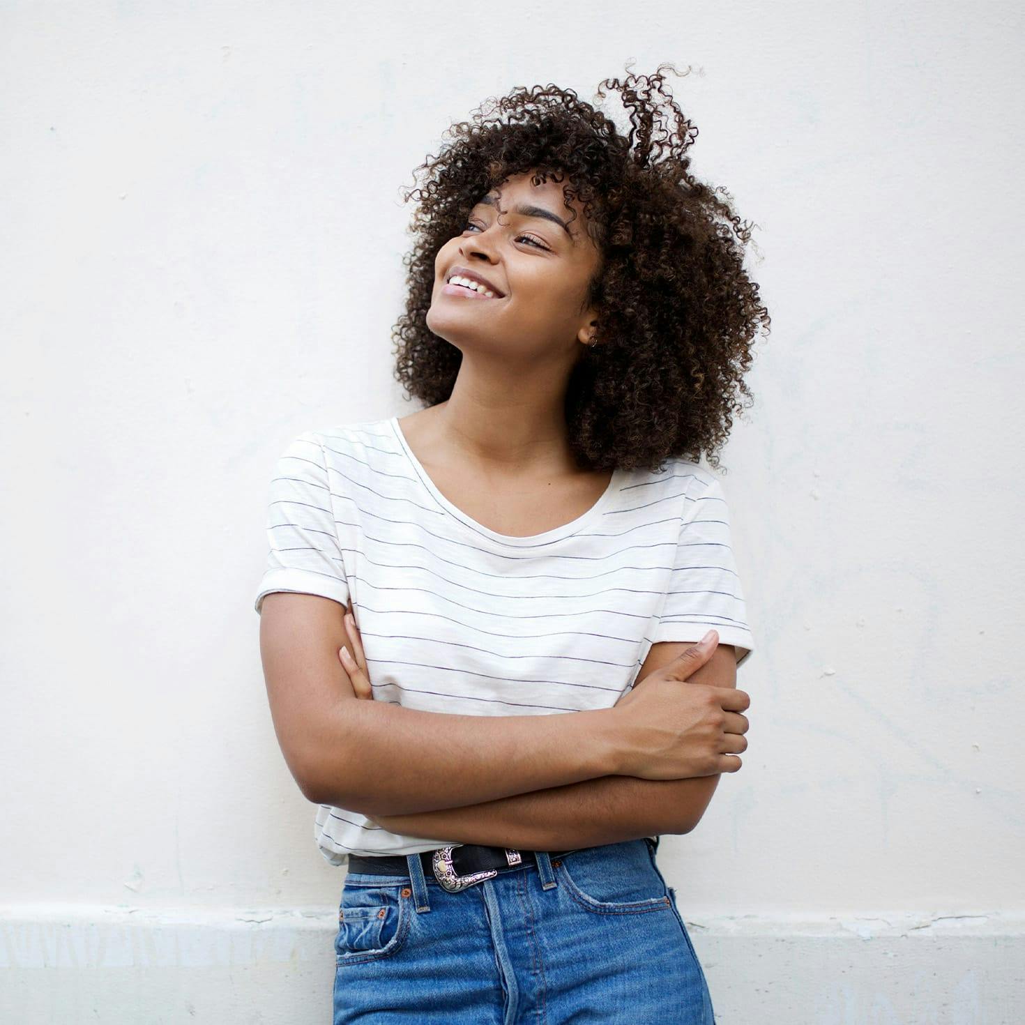 smiling woman crossing her arms