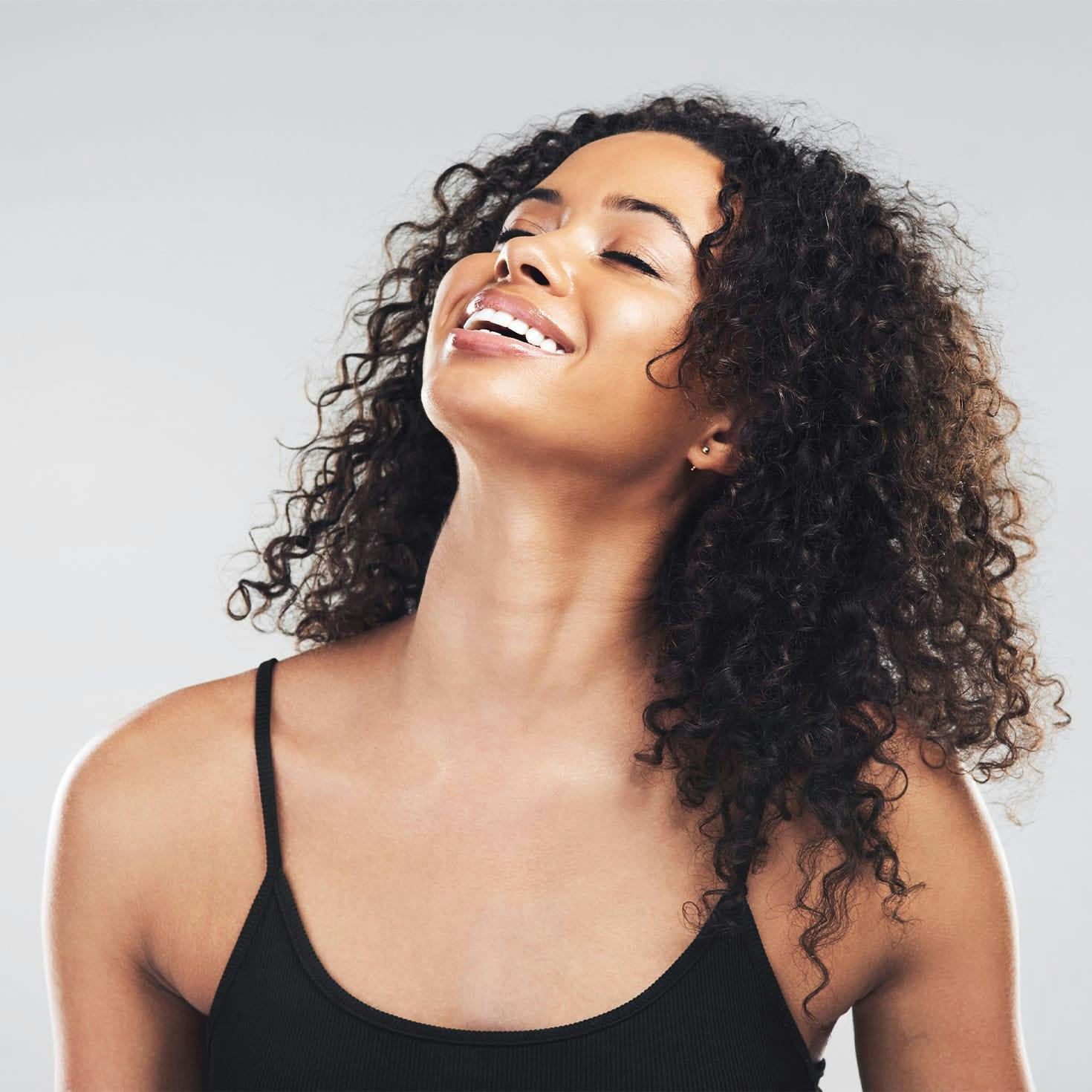 woman looking up, smiling