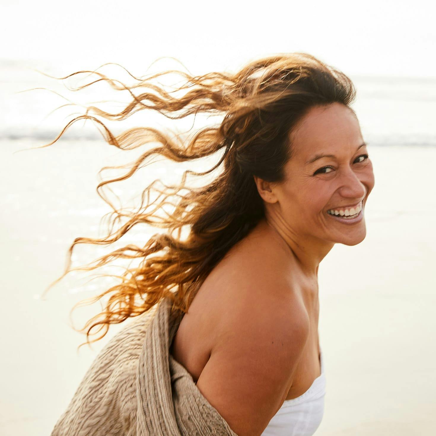 woman smiling on a beach