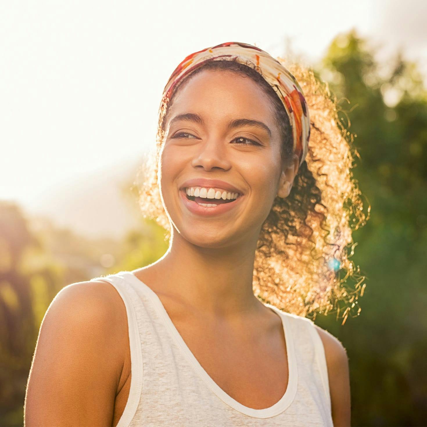 smiling woman standing outside
