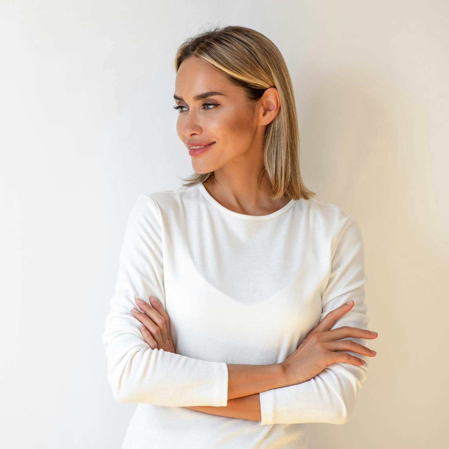 smiling woman crossing her arms