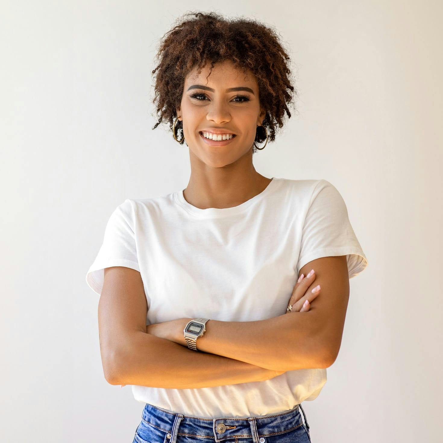 smiling woman crossing her arms