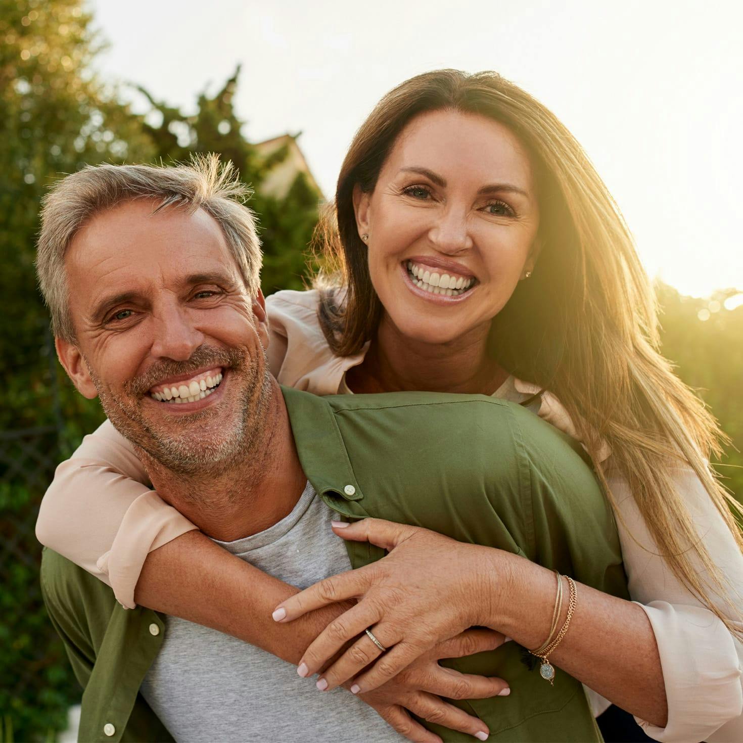 woman hugging a man from behind
