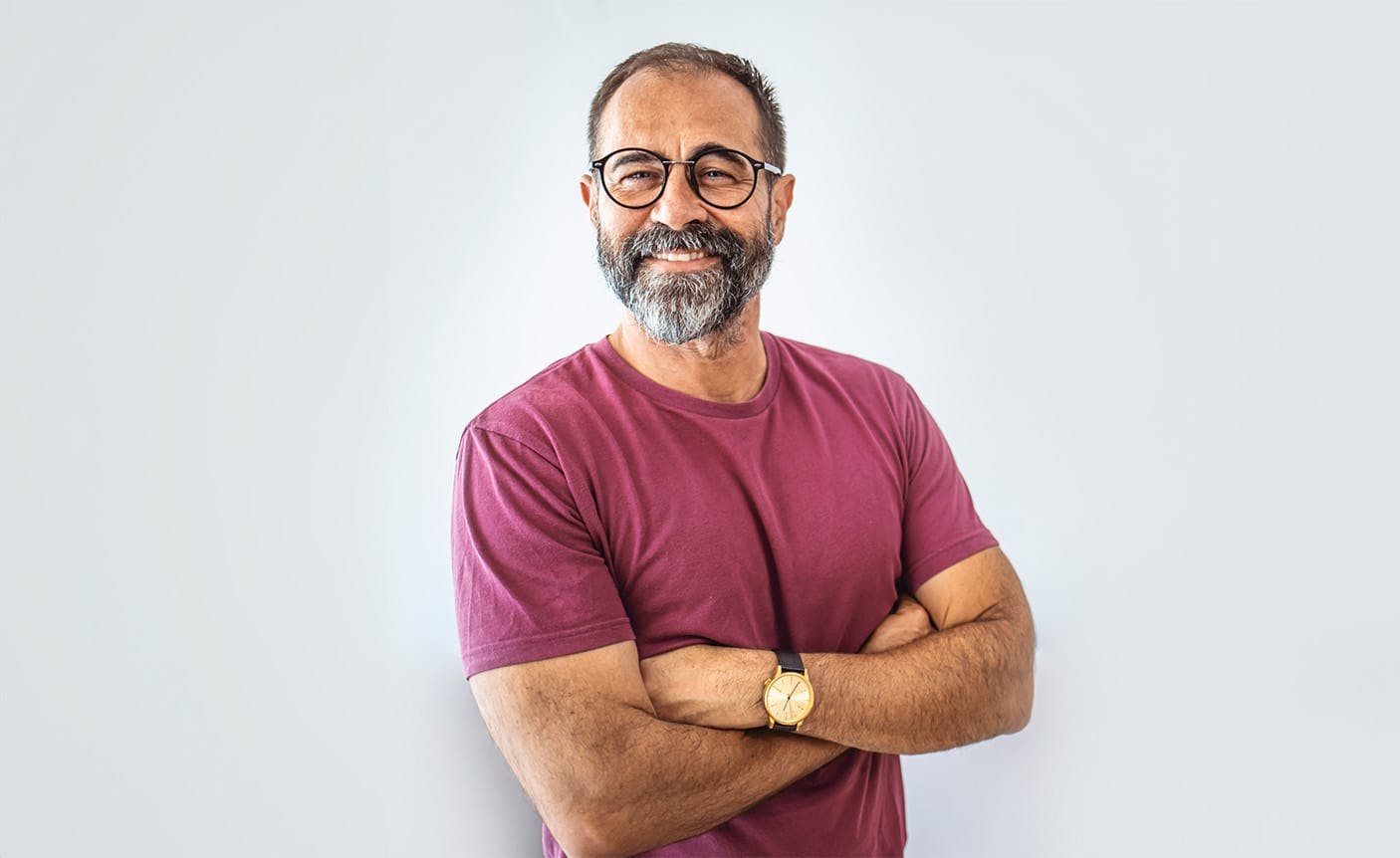 smiling man crossing his arms