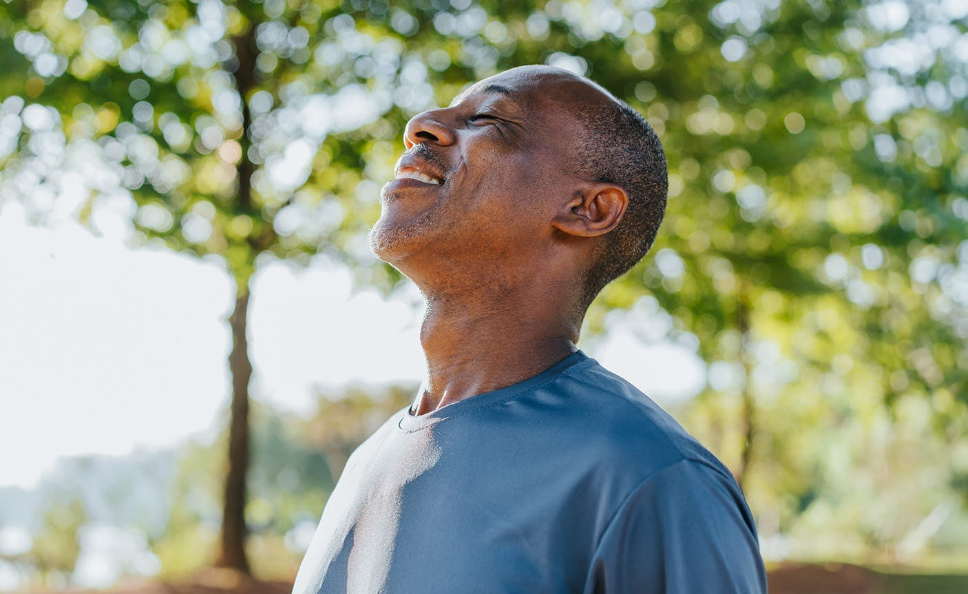 man looking up, smiling