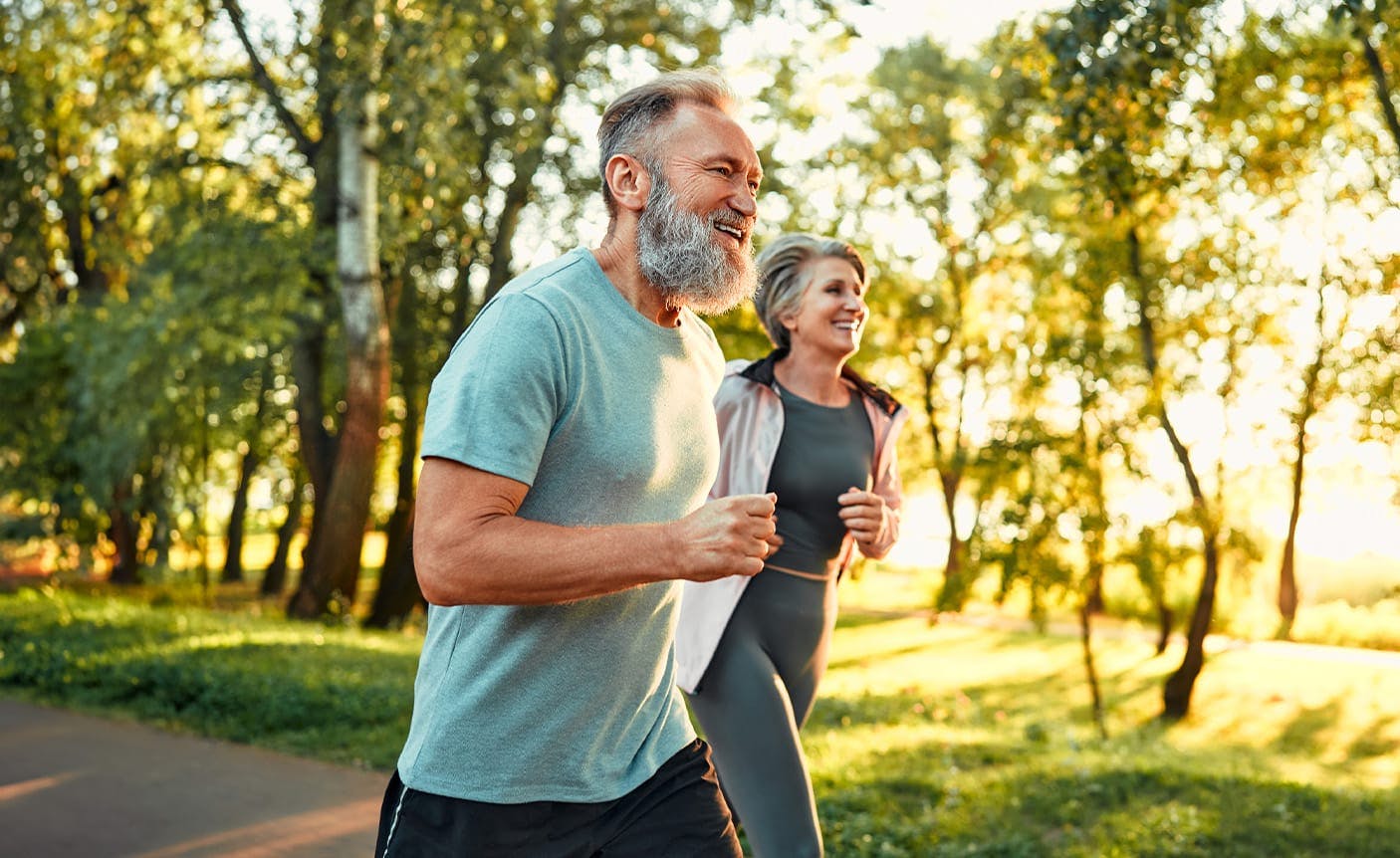 older man and woman on a jog