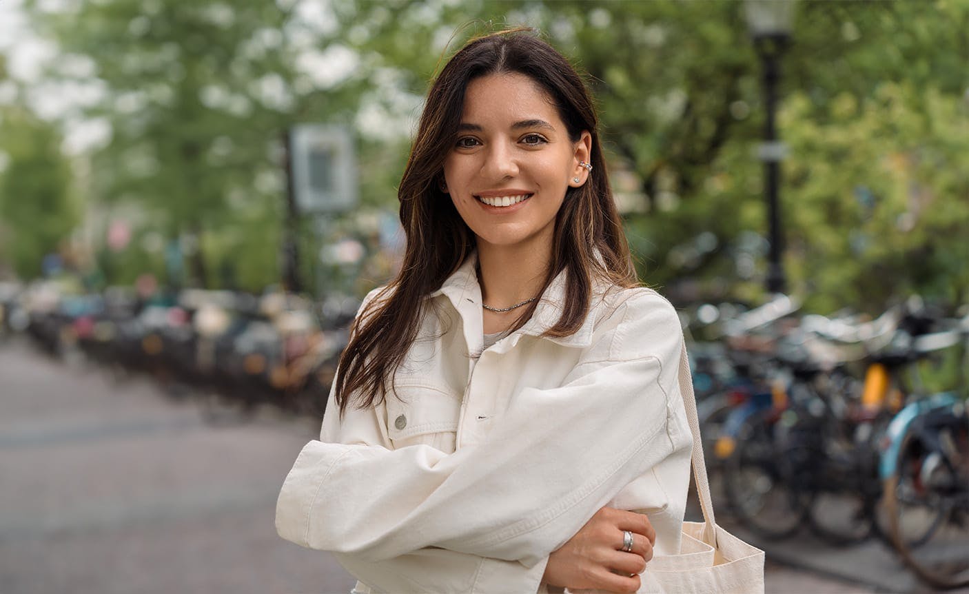 woman smiling, crossing her arms