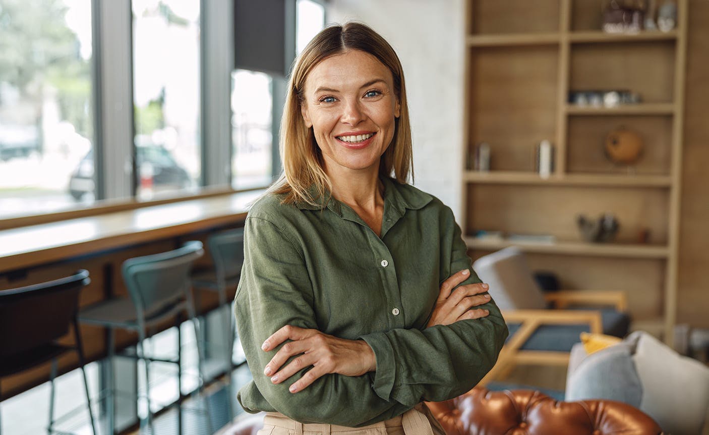 smiling woman crossing her arms