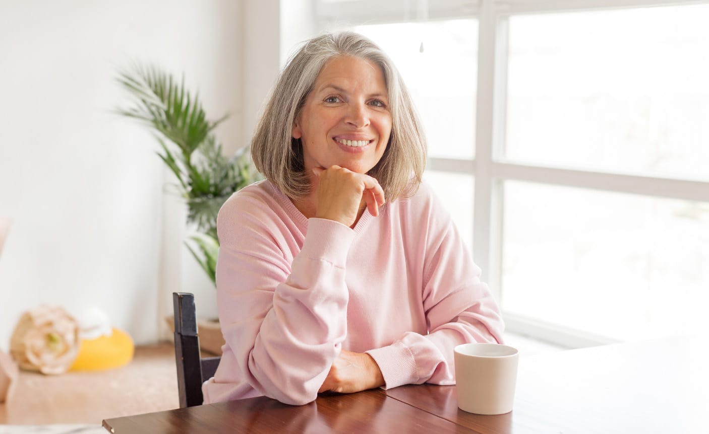 wolder woman sitting at a table