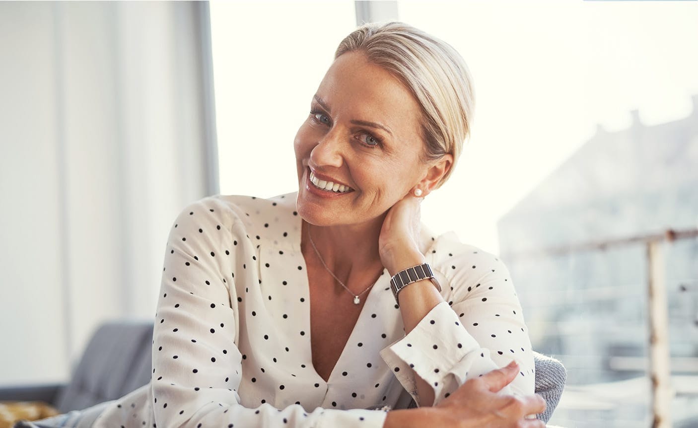 smiling woman leaning on her arm