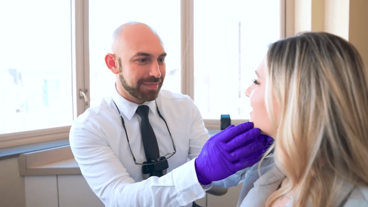 Doctor examining a patient's jaw