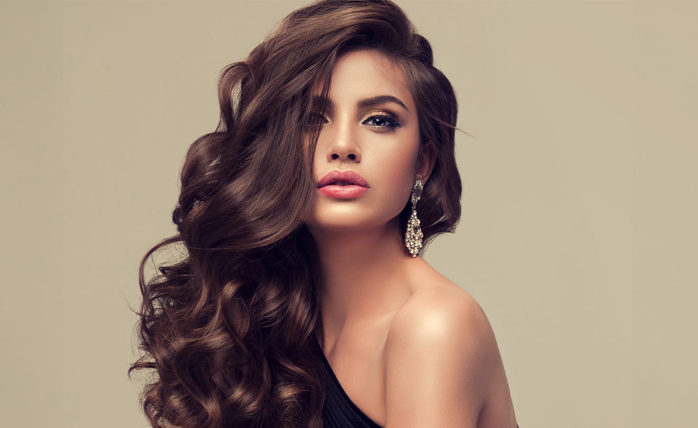 woman smiling, hair blowing in wind
