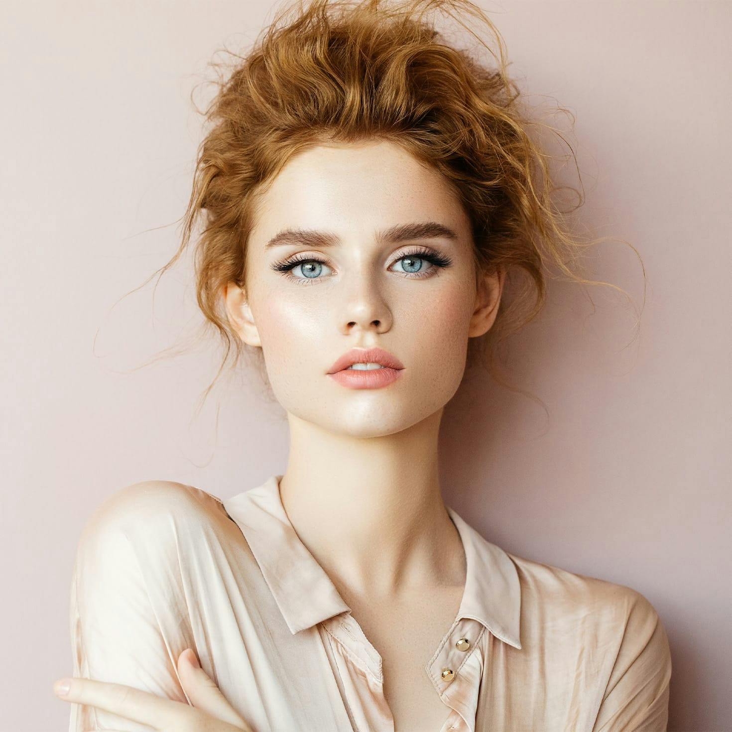 smiling woman crossing her arms