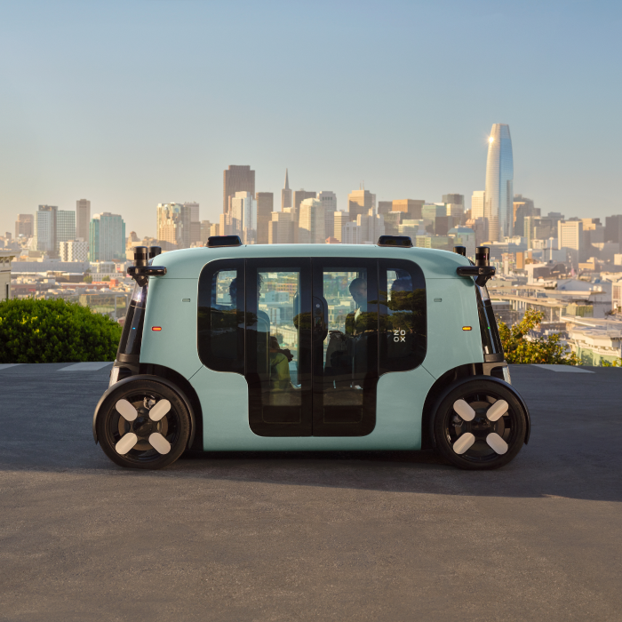 A Rovo car overlooking the San Francisco skyline and Salesforce Tower at sunset