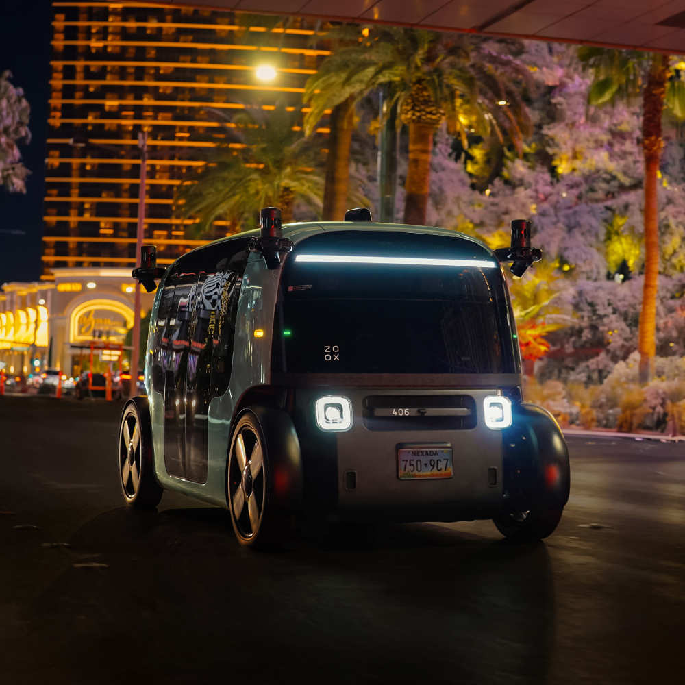 A Rovo car driving down the Las Vegas strip at night