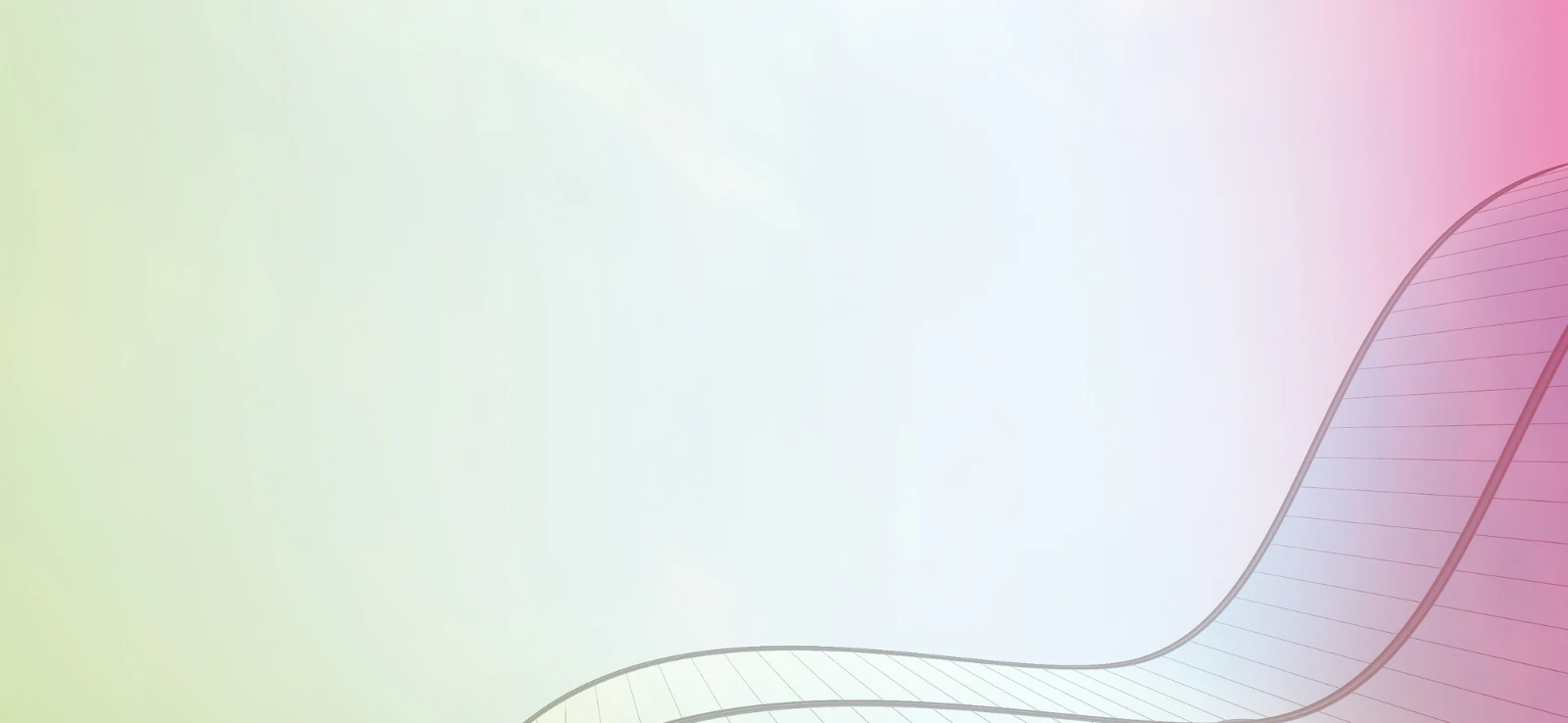 Looking up at a building with curved walls into the sky