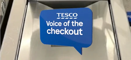 Supermarket self service register with eyes and mouth on screen with white background