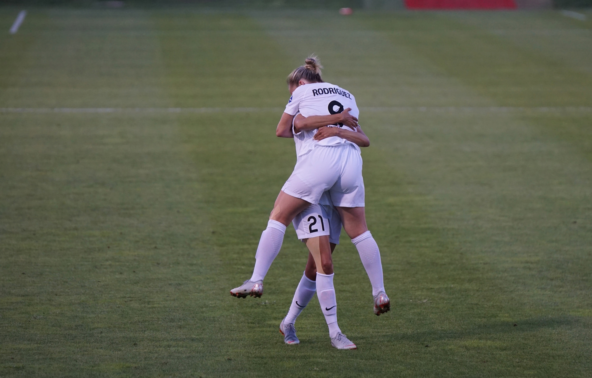 Two women celebrating playing football